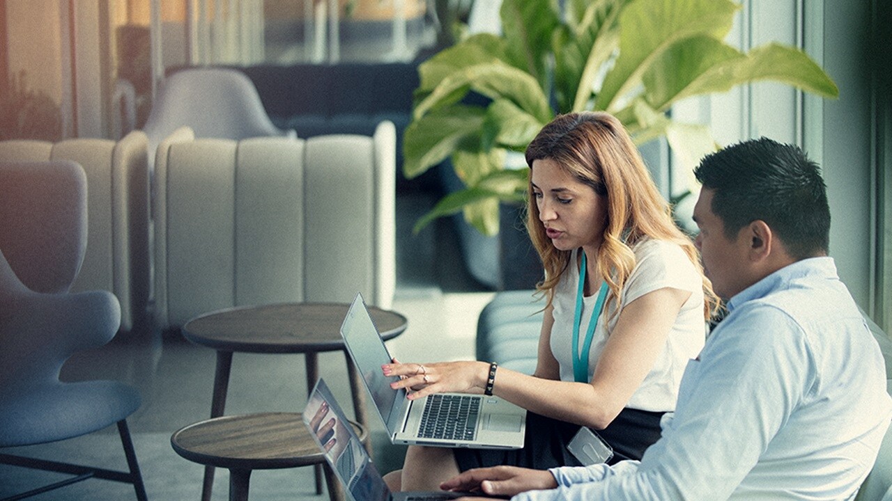 An employee discussing the projects details with colleague