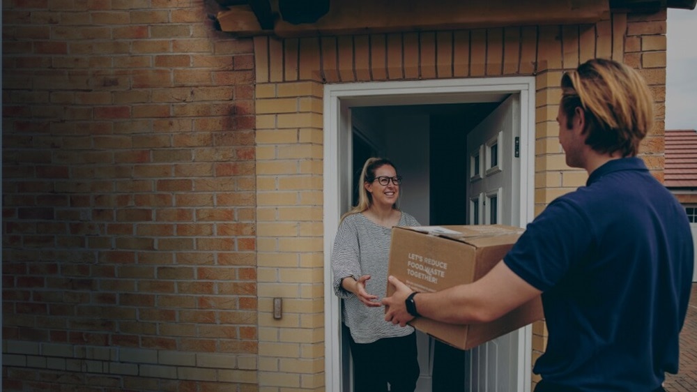 Male delivering a shipment to a female
