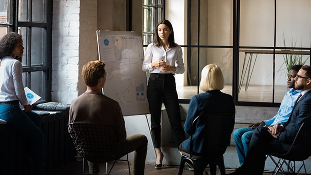 The employees are discussing procurement professional development opportunities actively.