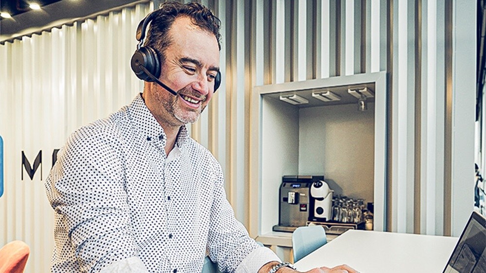 Employee working waring headphones