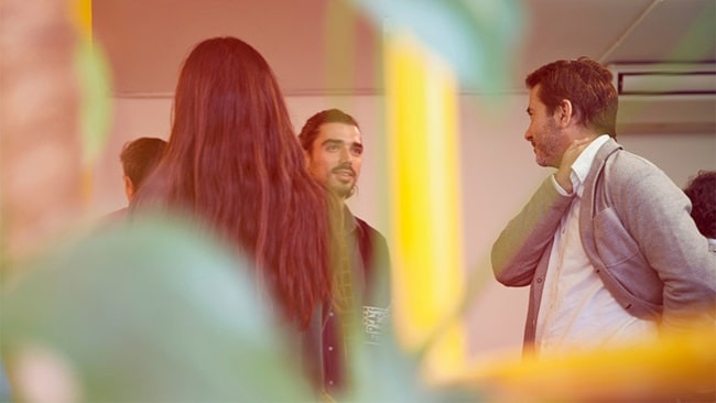 Business owners talking about new customs tariffs and regulations.