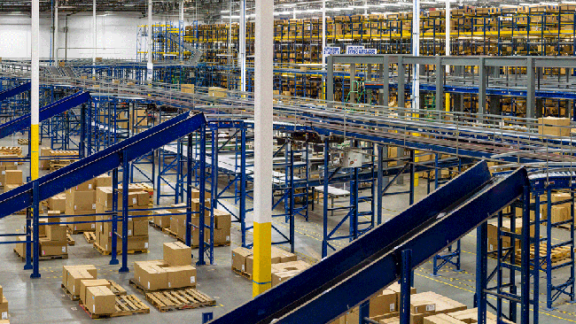 Warehouse interior filled with boxes and conveyor belt system