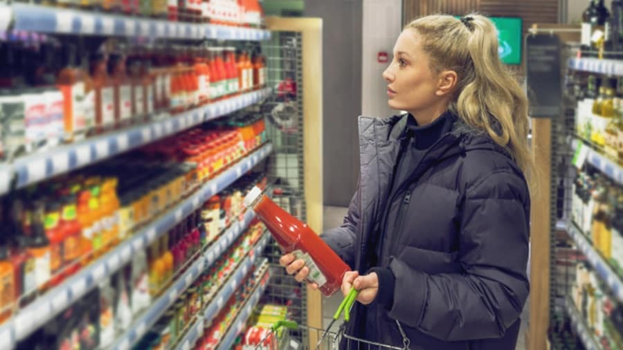Woman holding a product at a store