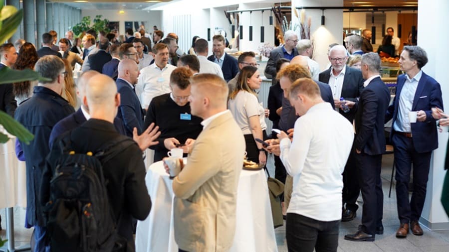 Group of people conversing at an event