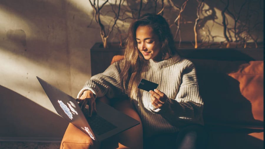 Female smiling looking at her laptop