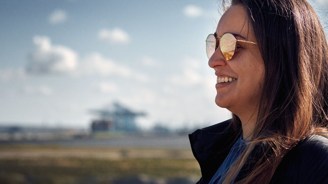 A woman smiles, representing the news that Maersk has been recognised as a Leader in the 2024 Gartner® Magic Quadrant™ for Third-party Logistics for the third year in a row