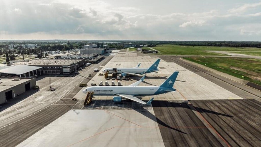 Overview shot of two plane parked on an airstrip