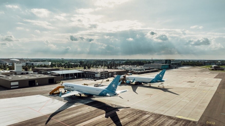 Overview shot of two plane parked on an airstrip