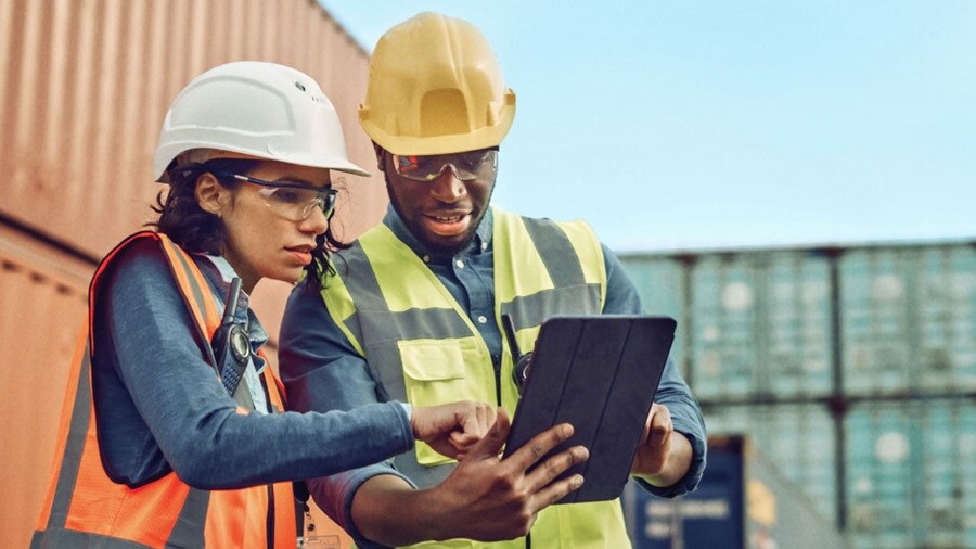 Woman man looking into tab
