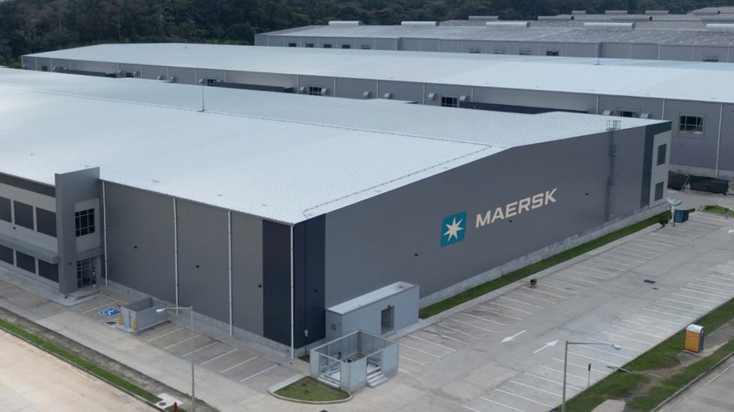 Maersk warehouse facility with large grey buildings and empty parking spaces in Panama Pacifico.