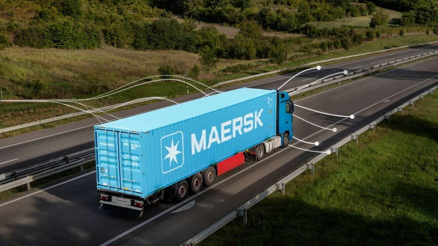 Maersk container truck driving on a rural road.