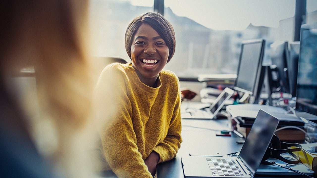 Woman in office working on laptop