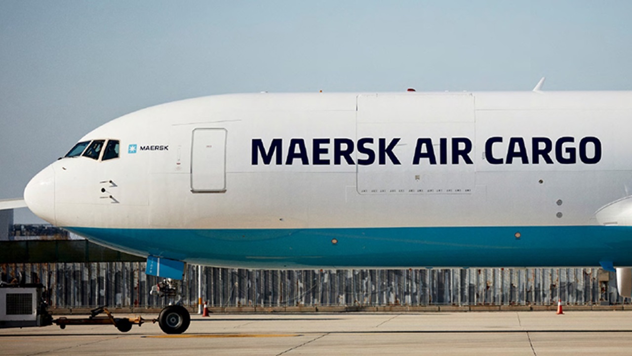 A Maersk Air Cargo airplane is parked on the tarmac.
