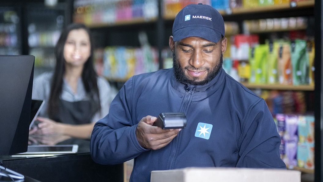 Maersk delivery person delivering orders to a commercial premises