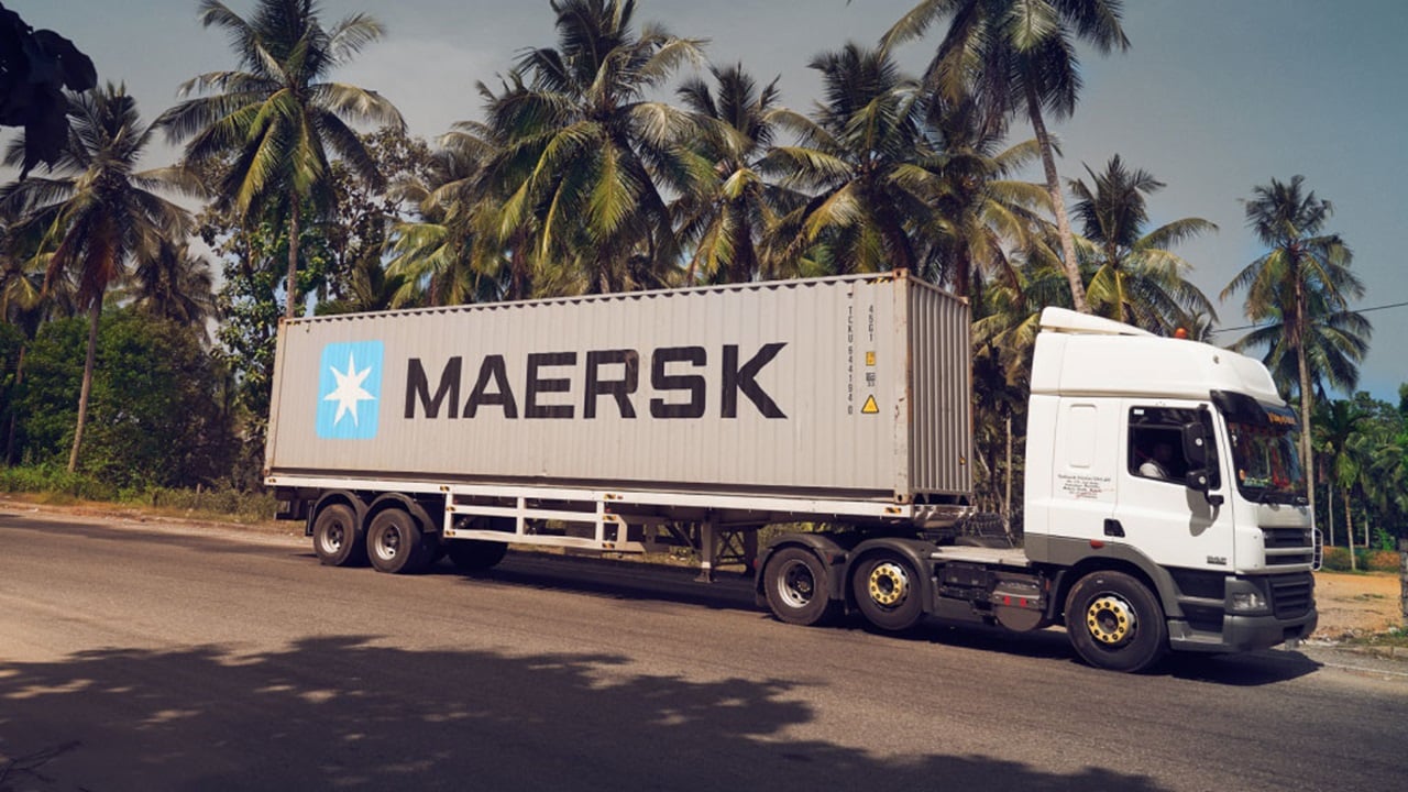 Maersk container on a truck driving on a road